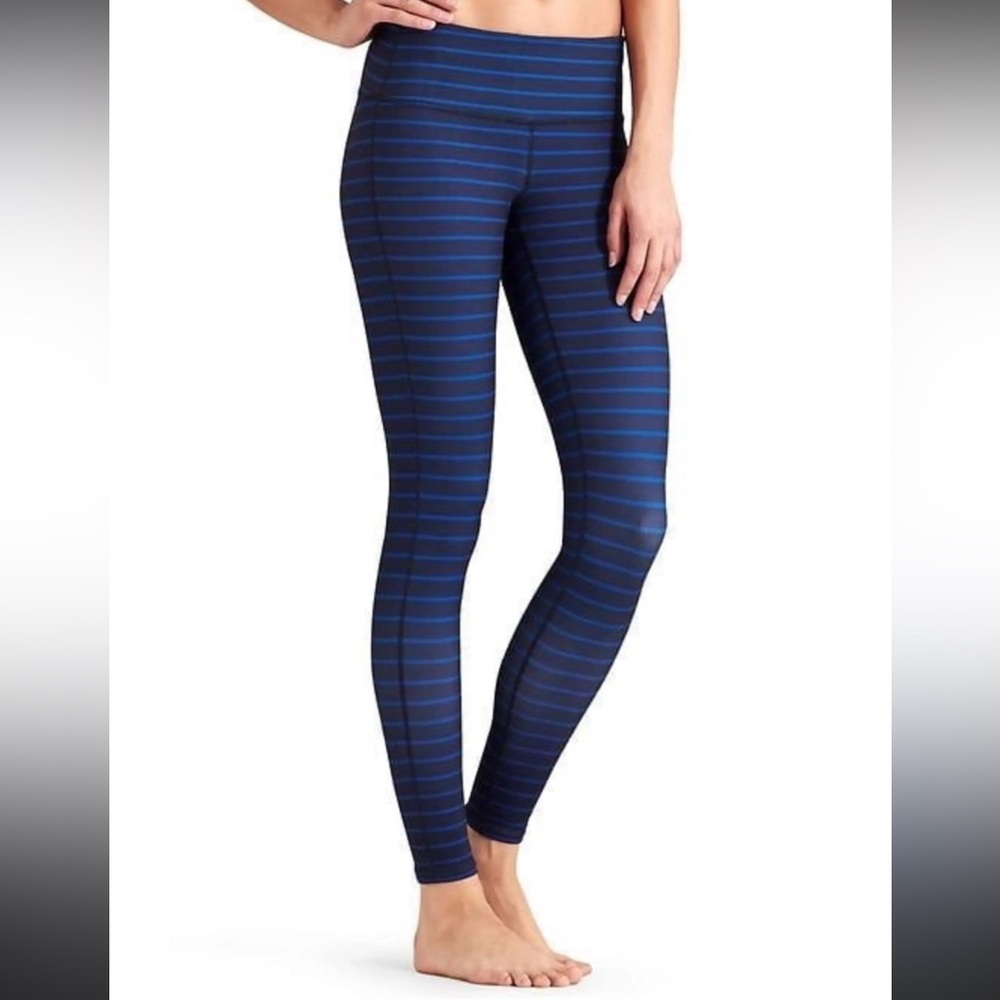 Athleta Chaturanga Tight in a navy blue horizontal stripe pattern